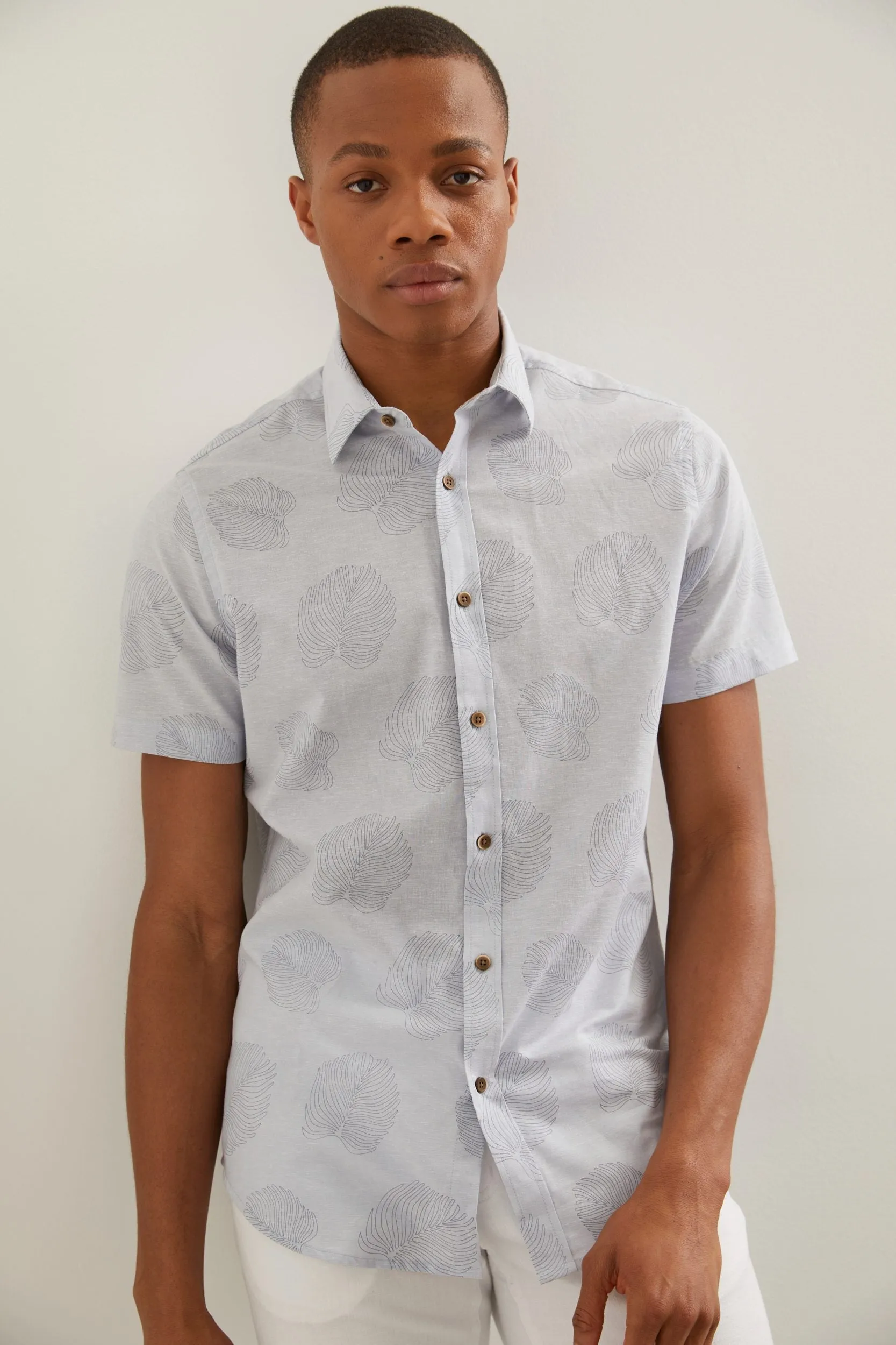 Fitted shirt with palm tree leaf print sold by Tristan Style