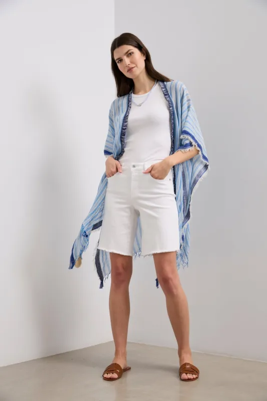 Striped cape with fringes sold by Tristan Style