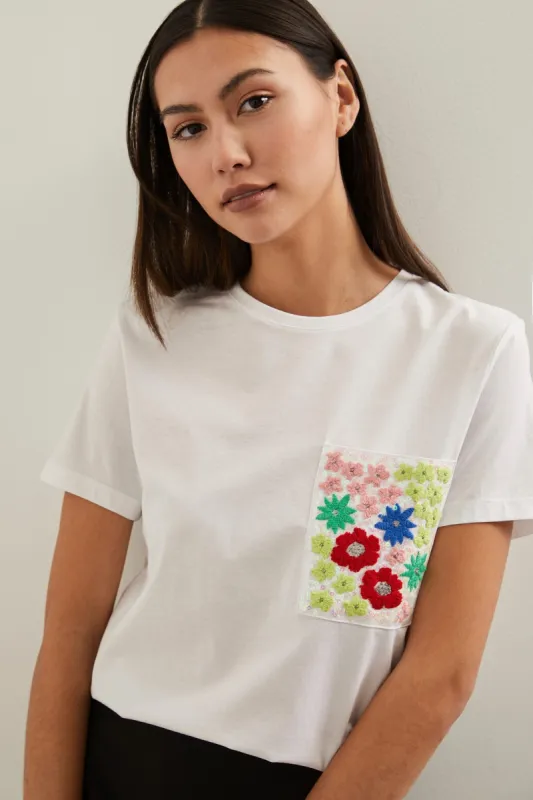 T-shirt with embellished pocket sold by Tristan Style