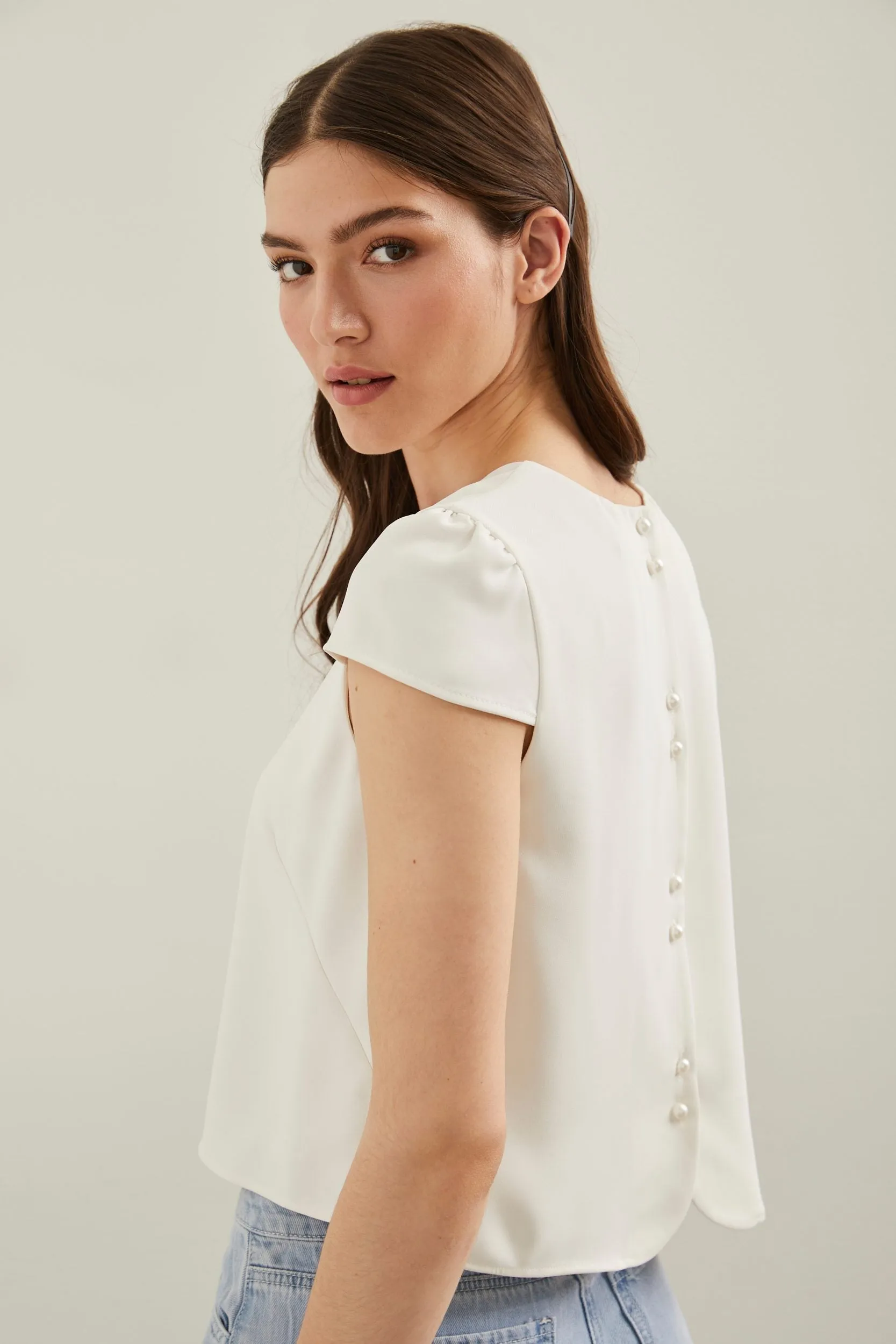 Cropped top with cap sleeves sold by Tristan Style