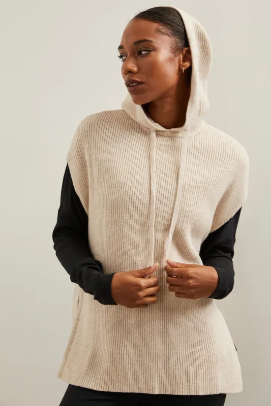 Sleeveless sweater with hood sold by Tristan Style