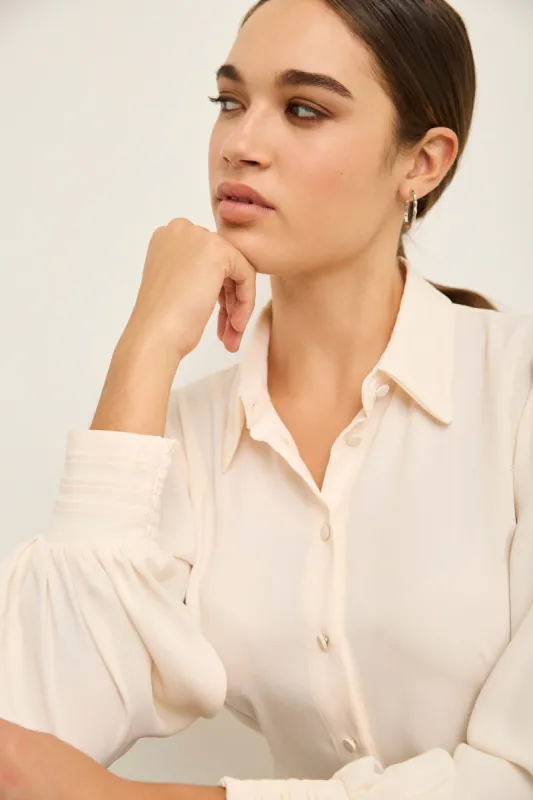 Fitted blouse with puffy sleev sold by Tristan Style