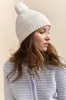 Tuque with pompom sold by Tristan Style