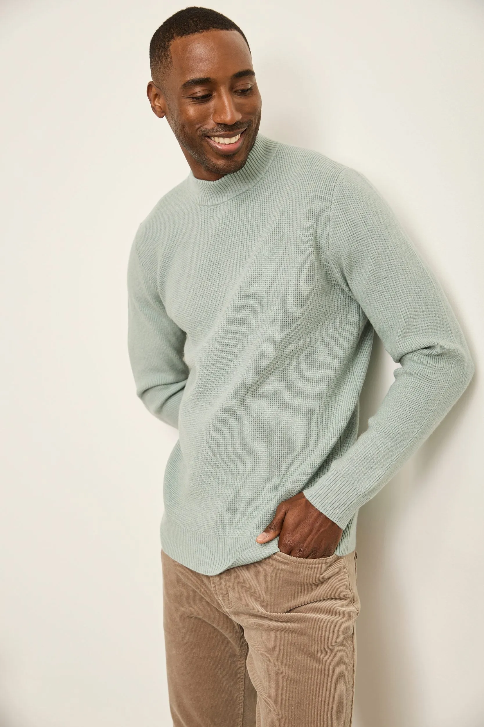 Textured mock neck sweater sold by Tristan Style