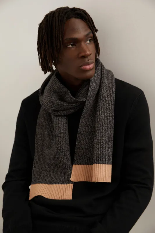 Two-tone knittted scarf sold by Tristan Style