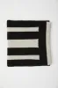Cable-knit scarf sold by Tristan Style