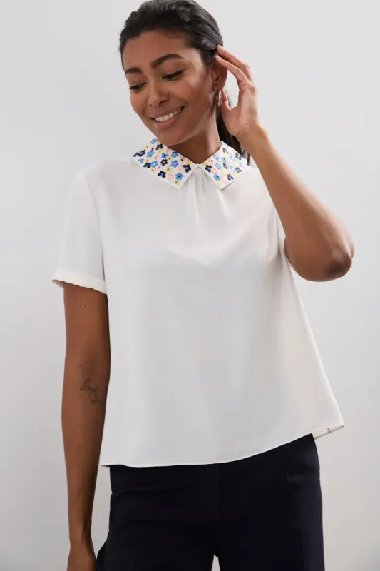 Embroidered collar blouse with buttons on the back sold by Tristan Style