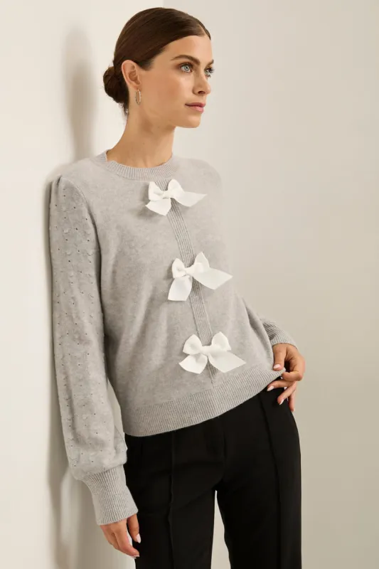 Sweater with grosgrain bows sold by Tristan Style