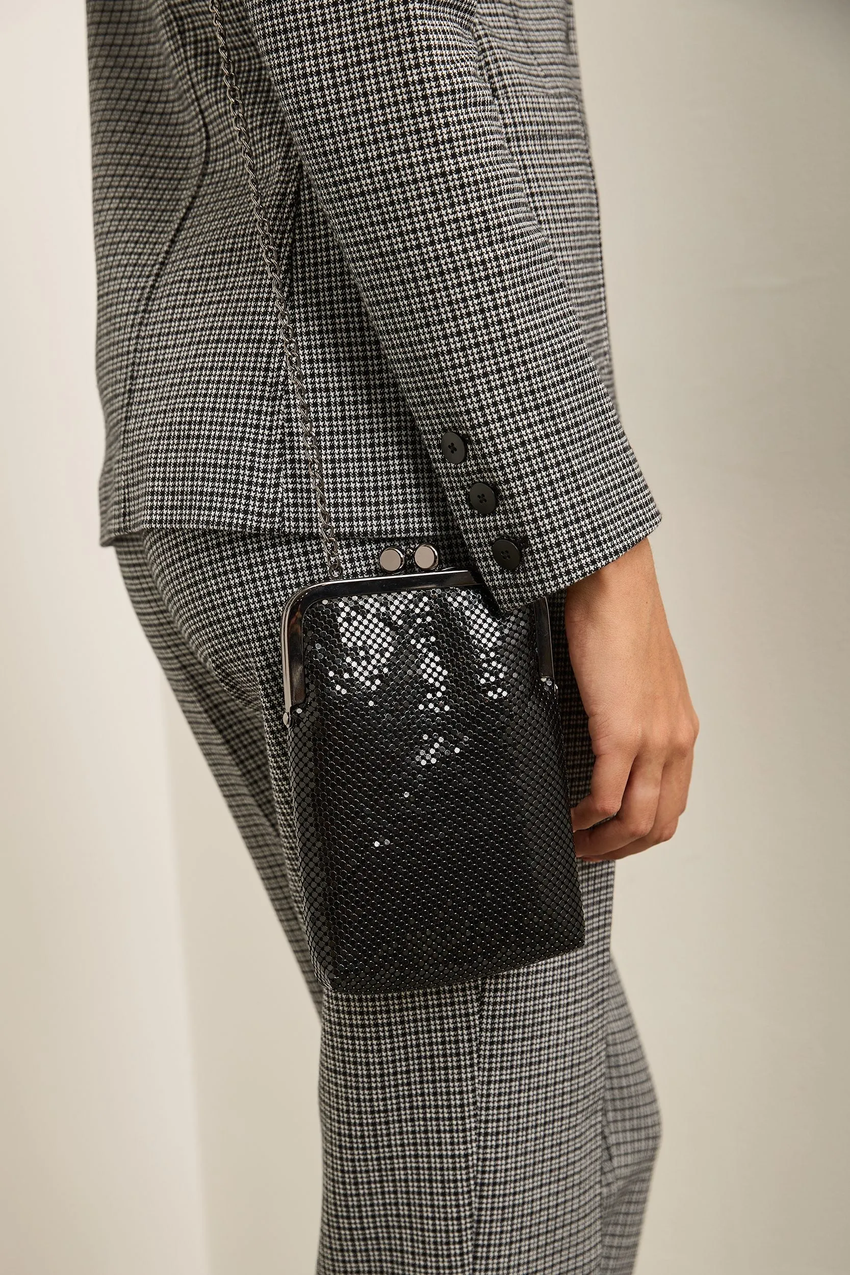 Metallic clutch bag sold by Tristan Style