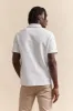 Polo with textured stripes sold by Tristan Style
