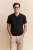 Polo with detail at collar sold by Tristan Style