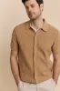Cable knit front short sleeve cardigan sold by Tristan Style