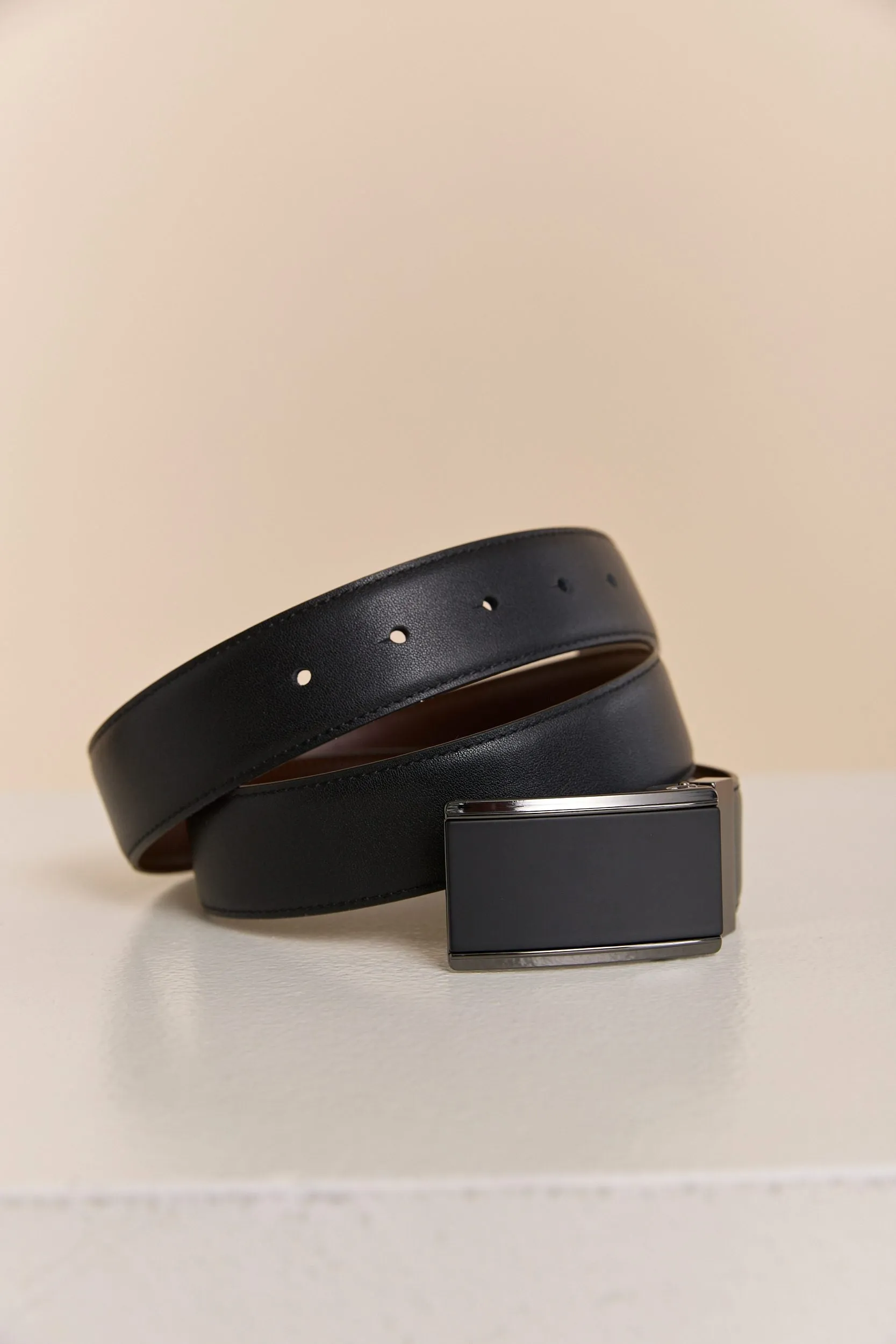 Plate buckle reversible leather belt sold by Tristan Style
