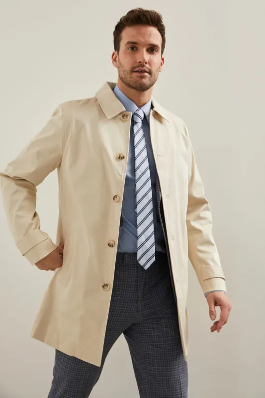 Hidden placket trench coat sold by Tristan Style