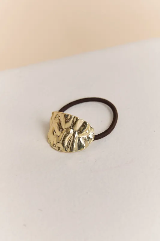 Textured metal hair tie sold by Tristan Style