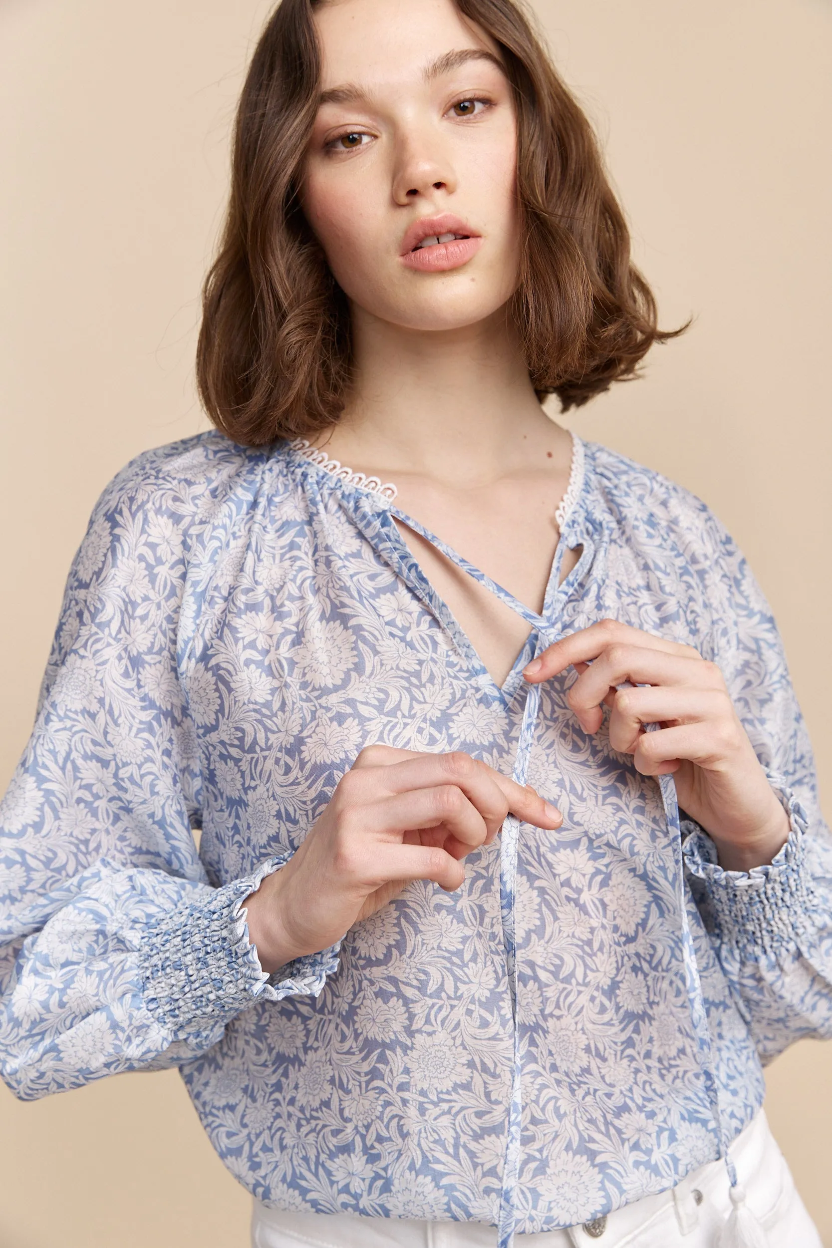 Semi-sheer blouse with floral print sold by Tristan Style