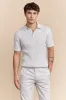 Cable-knit polo sold by Tristan Style