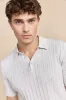 Cable-knit polo sold by Tristan Style
