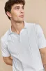 Textured vertical stripes polo sold by Tristan Style