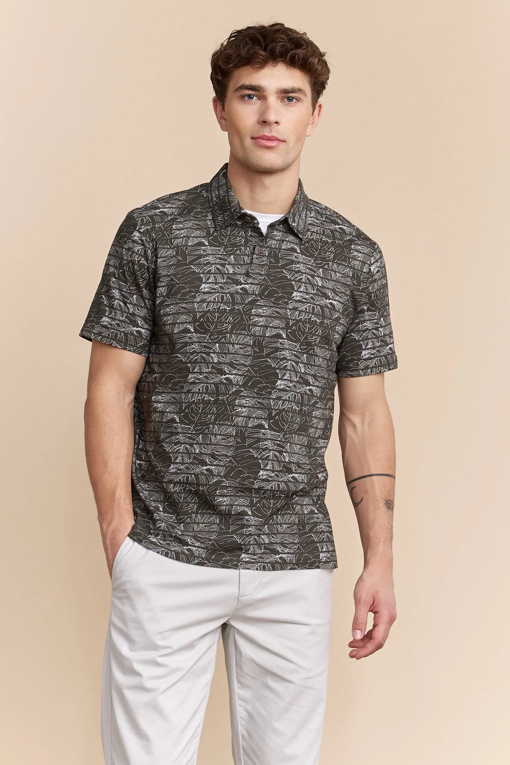Tropical print stripped polo sold by Tristan Style