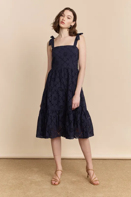 Navy eyelet dress sold by Tristan Style