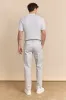 Slim fit pants with elastic sides sold by Tristan Style
