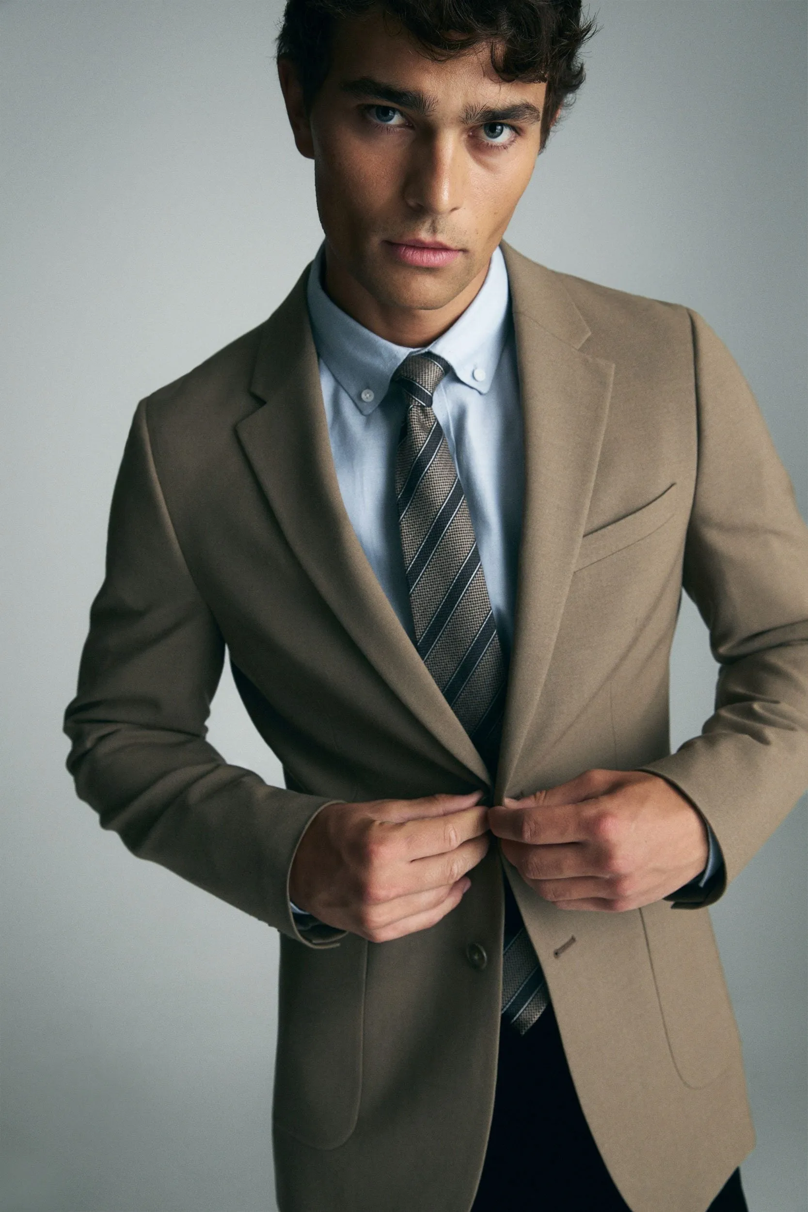 Solid color extra-fitted blazer sold by Tristan Style