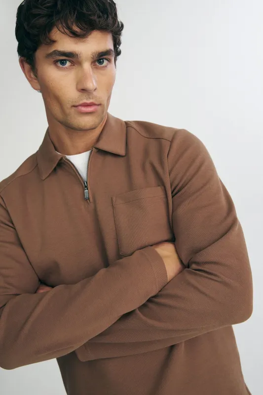 Long sleeve polo half zip with pocket sold by Tristan Style