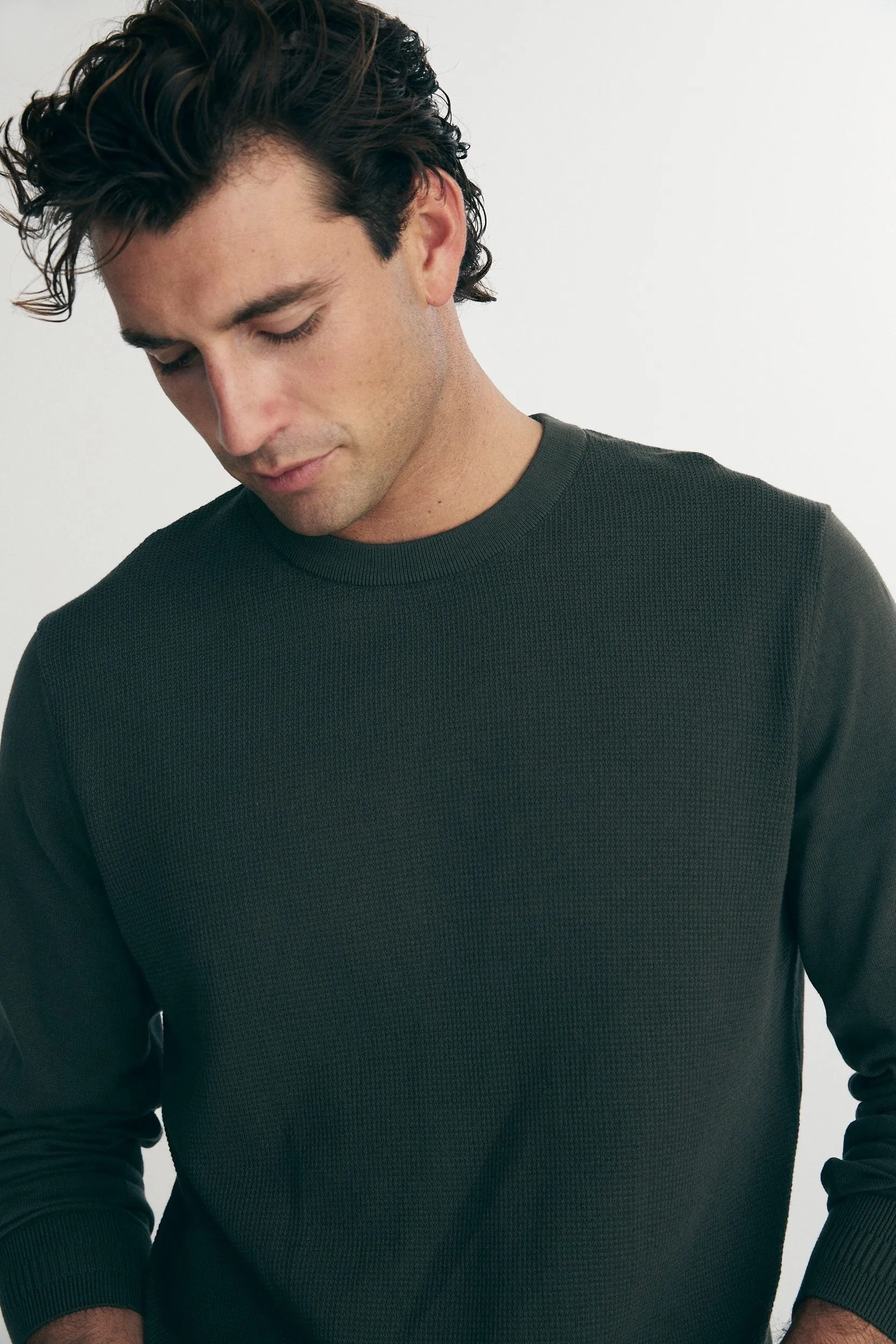 Textured front crew neck sweater sold by Tristan Style