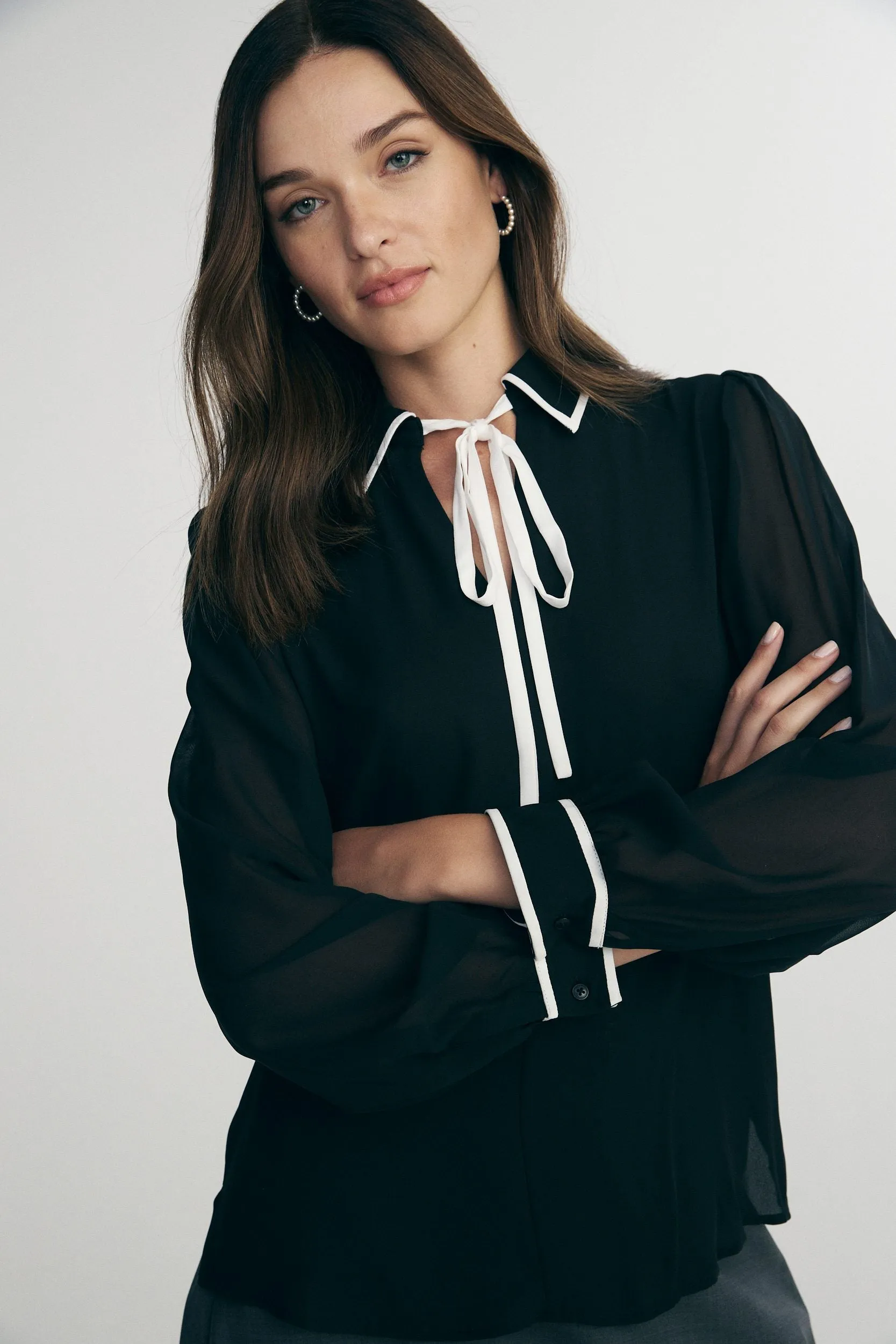 Puffy sleeve blouse with tie sold by Tristan Style