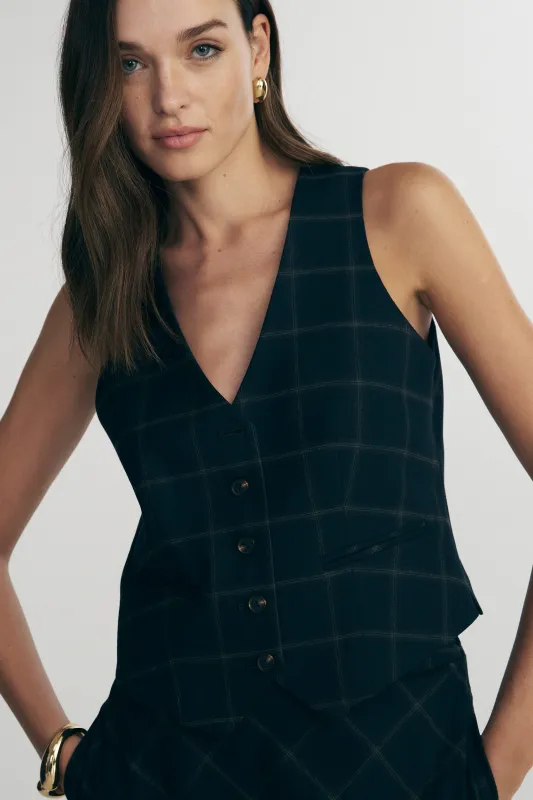Plaid vest sold by Tristan Style