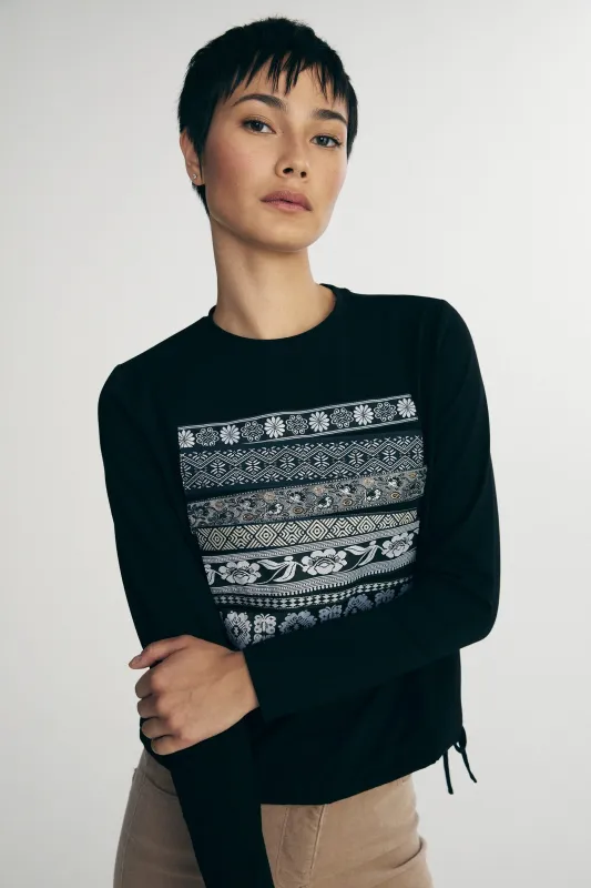 Crew neck top with applied ribbon sold by Tristan Style