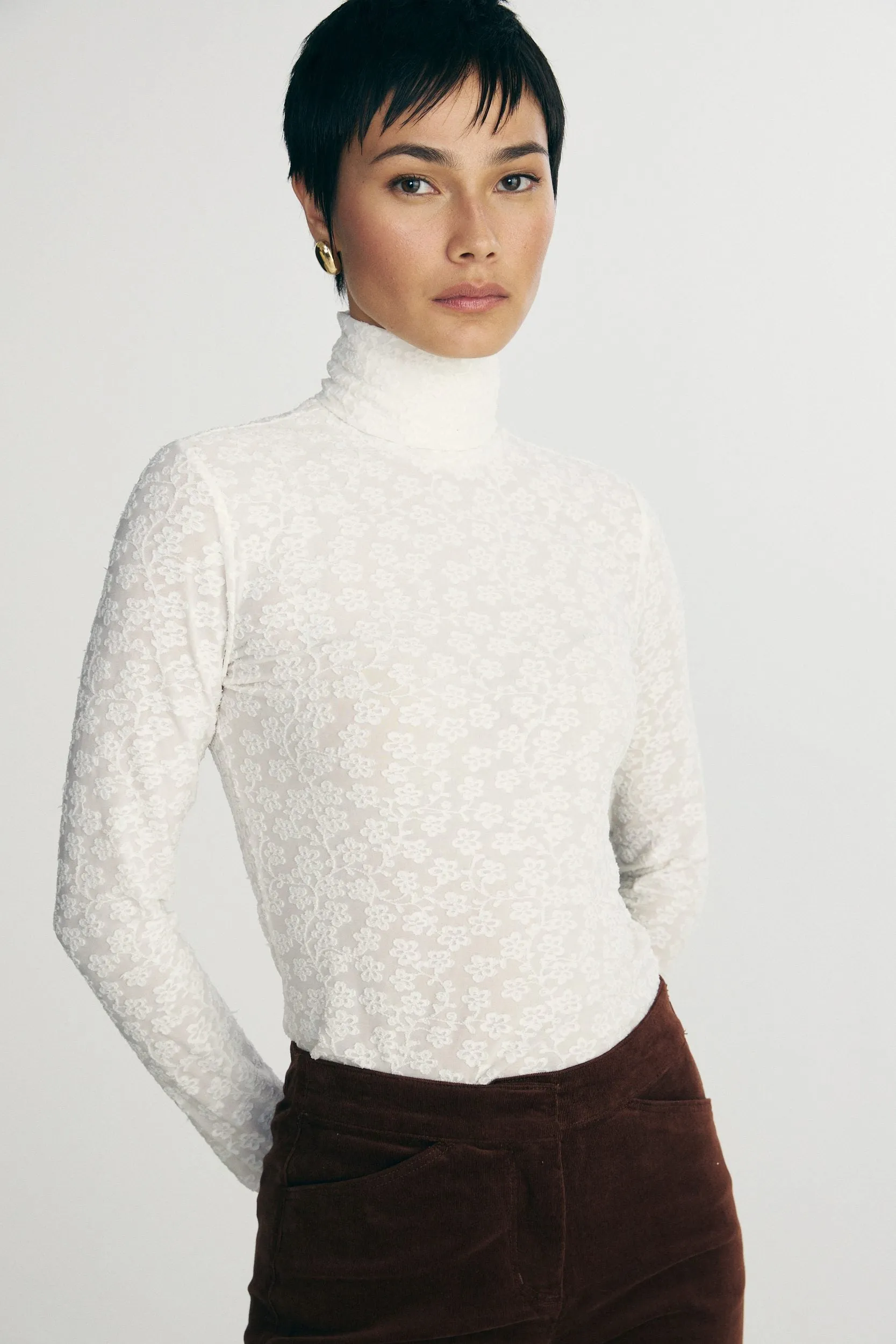 Turtle neck lace top sold by Tristan Style