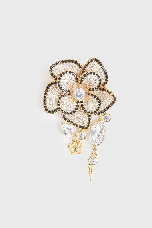 Golden flower brooch sold by Tristan Style