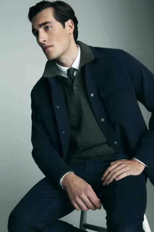 Cable-knit sweater with collar sold by Tristan Style