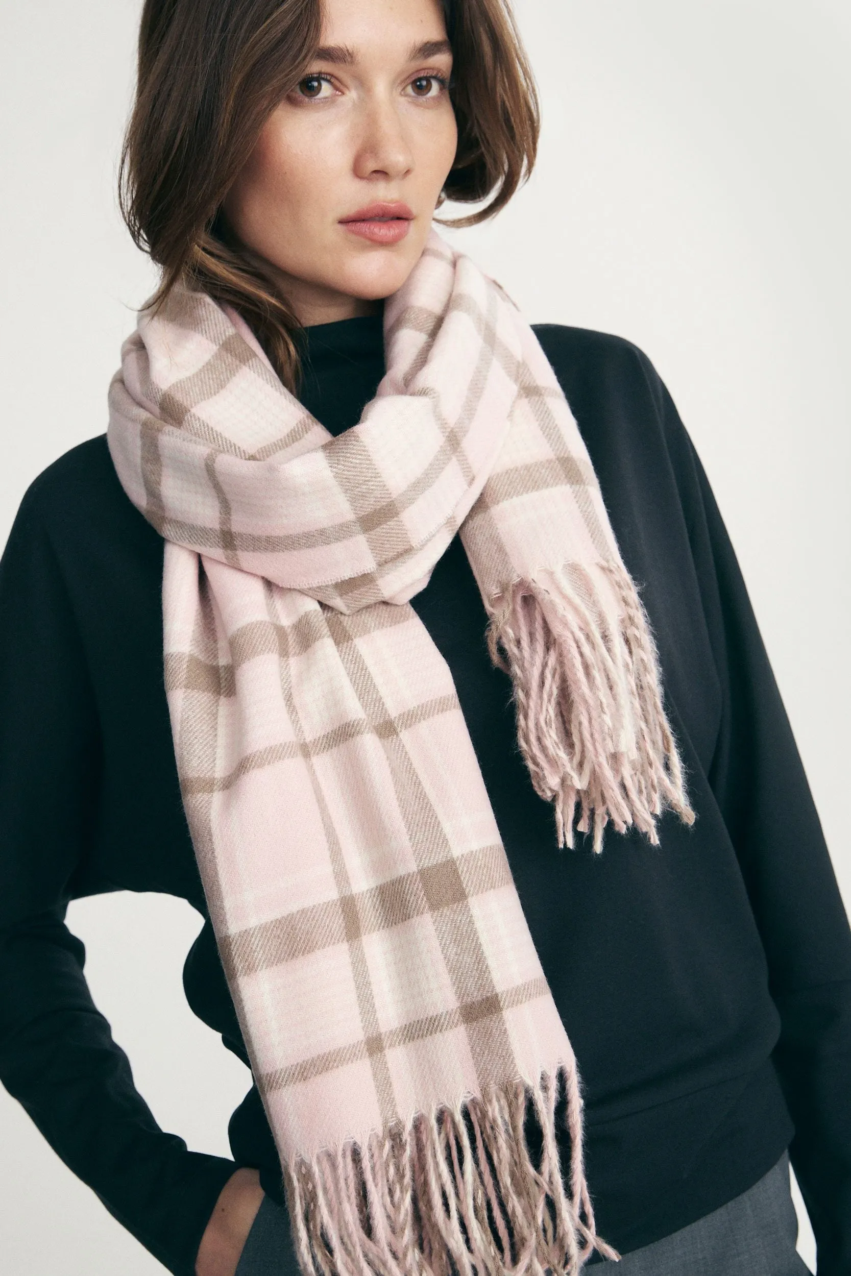 Fringed plaid scarf sold by Tristan Style