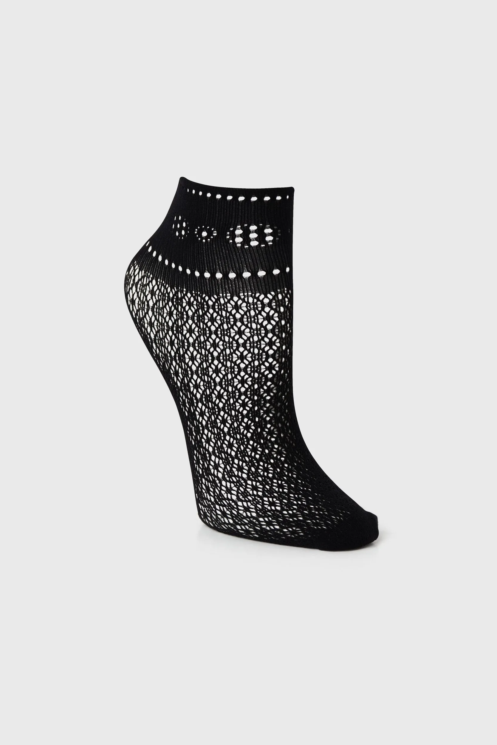 Fishnet socks with geometric pattern sold by Tristan Style