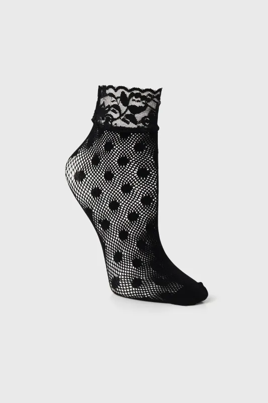 Polka dot fishnet socks with lace sold by Tristan Style