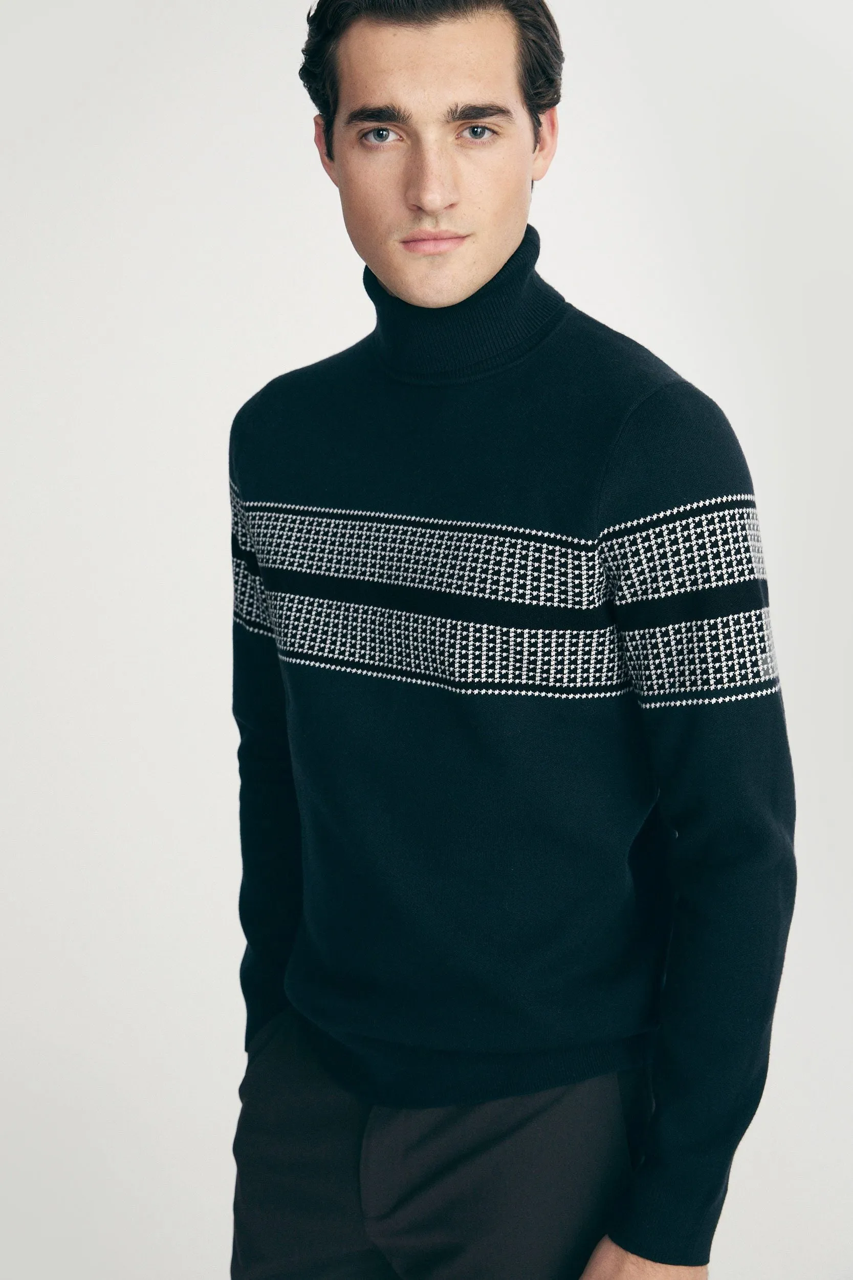 Houndstooth jacquard sweater sold by Tristan Style