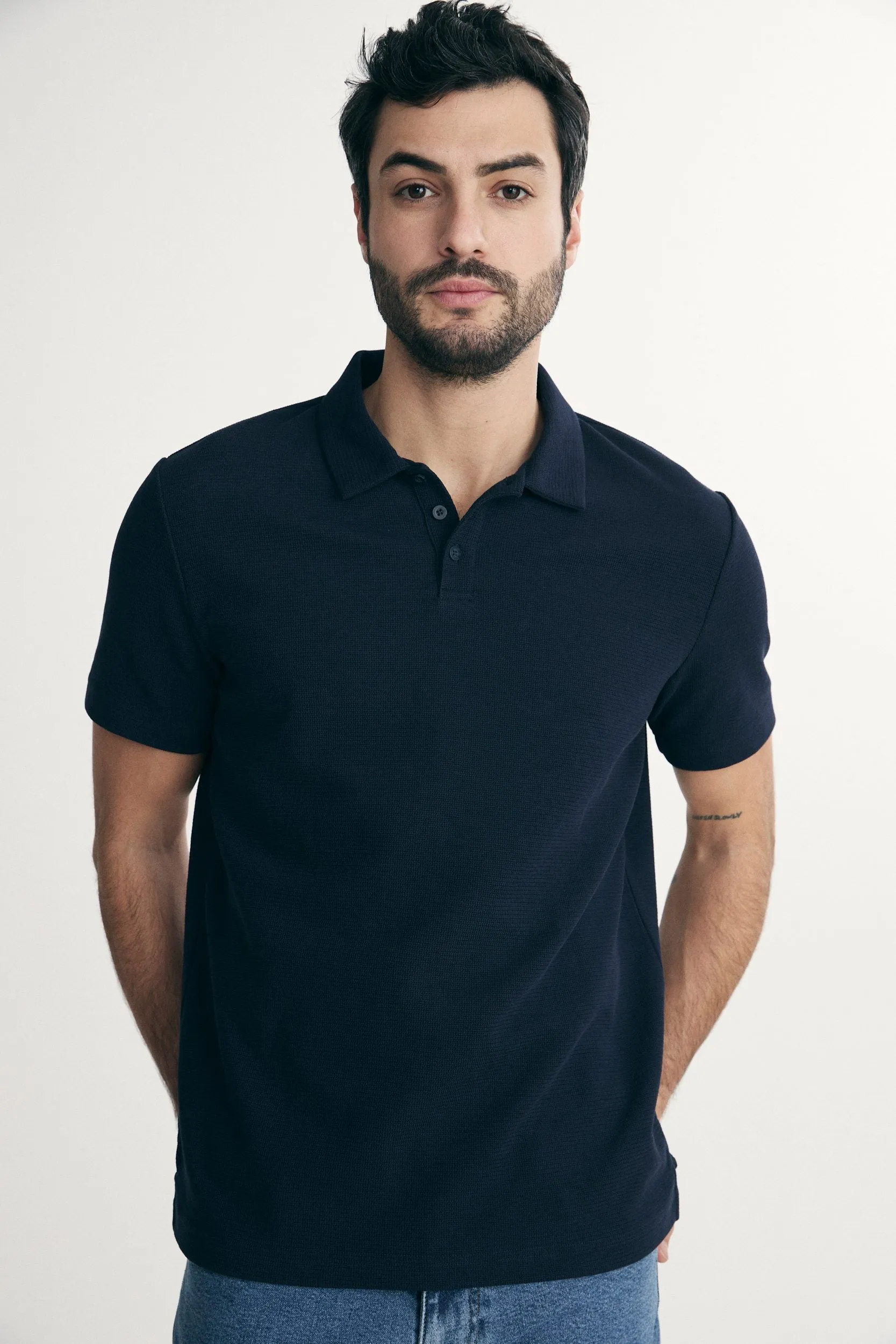 Textured polo sold by Tristan Style