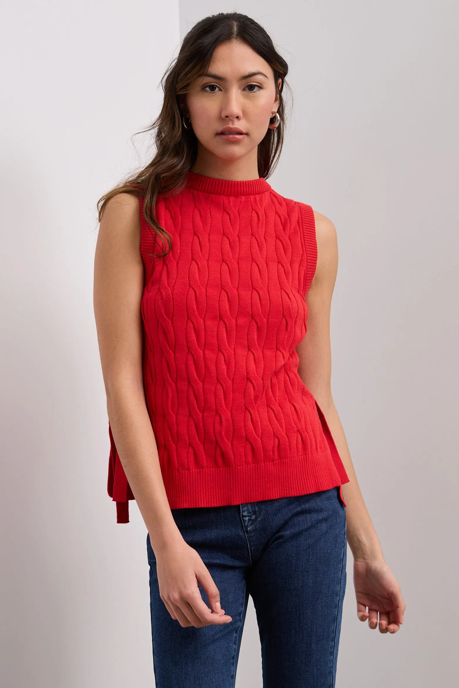 Sleeveless sweater tied at the sides sold by Tristan Style