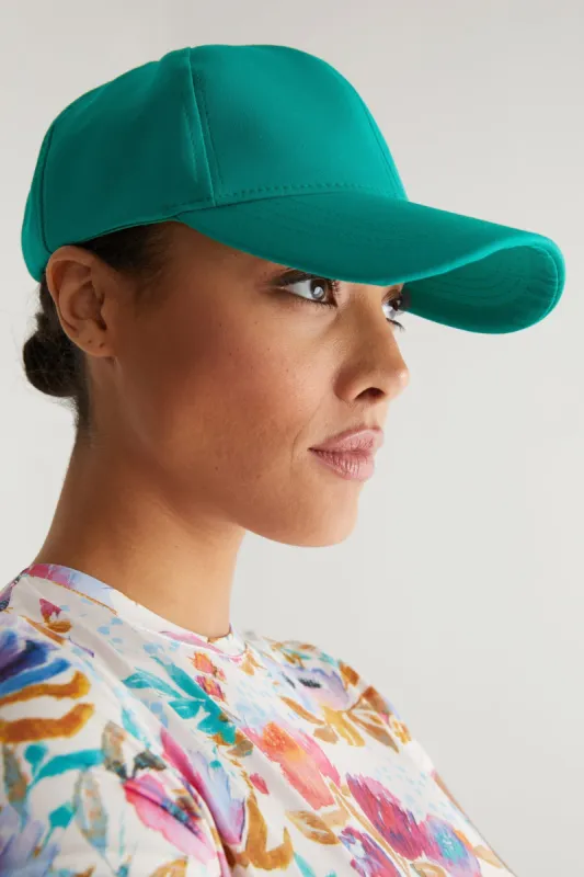 Bright green cap sold by Tristan Style