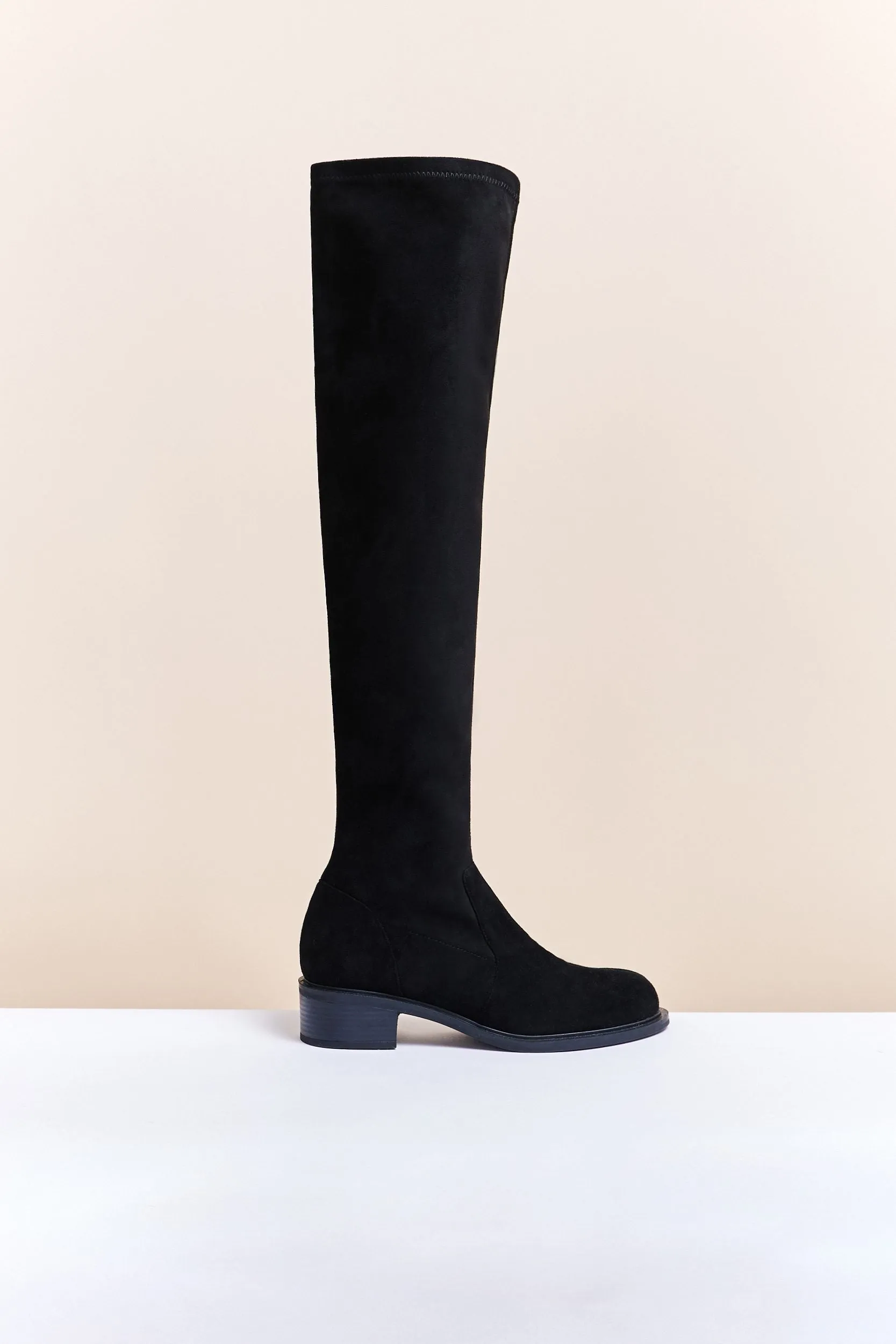 Over-the-knee suede boots sold by Tristan Style