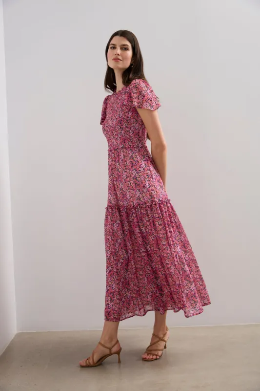 Long ruffle dress sold by Tristan Style