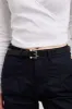 Belt with clear buckle sold by Tristan Style