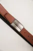 Plate buckle reversible leather belt sold by Tristan Style