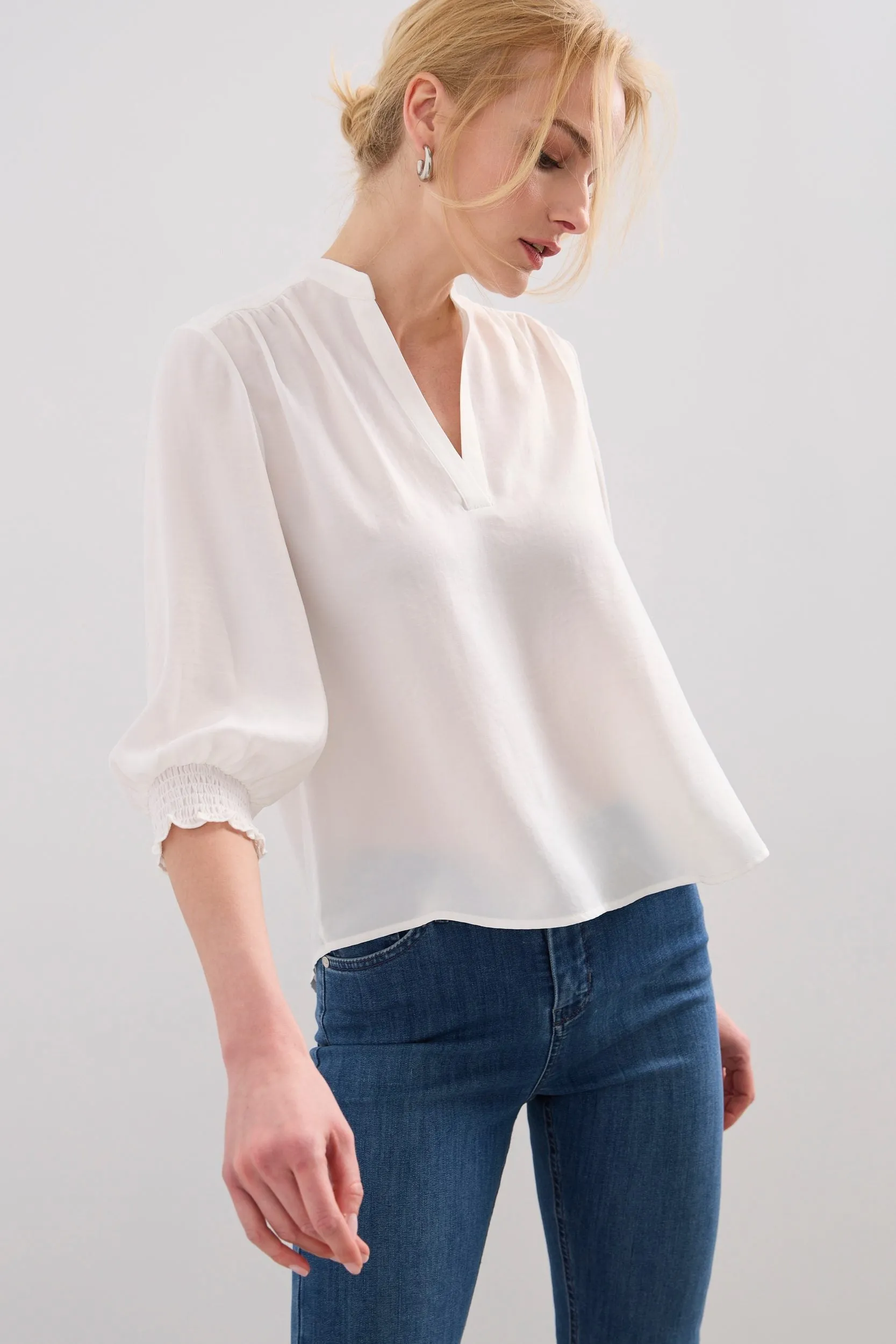 V-neck blouse with ruching detail sold by Tristan Style