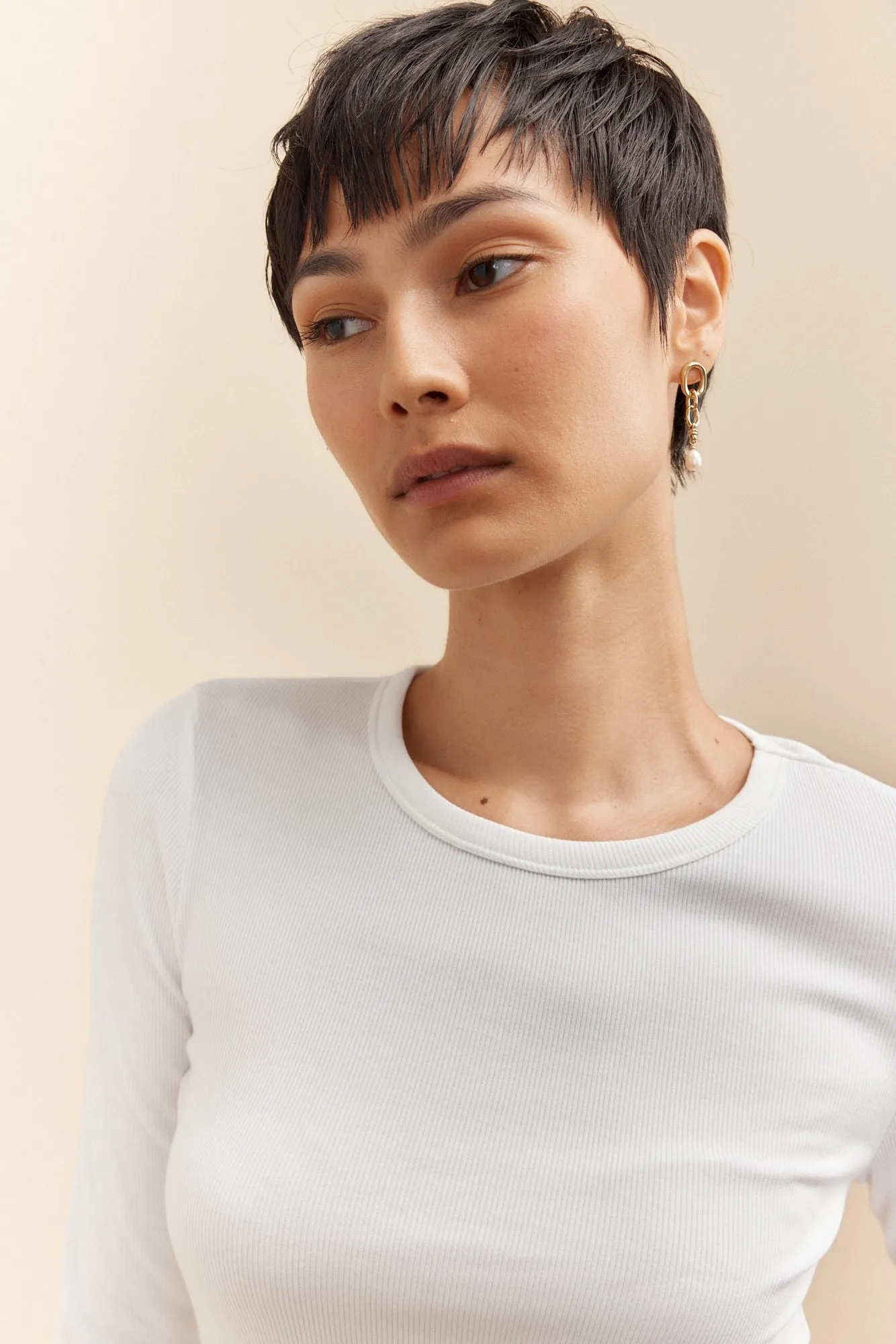 Stainlesss steel earring with pearl sold by Tristan Style