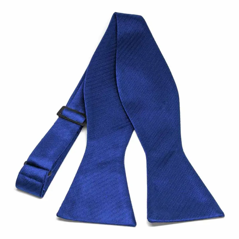 Sapphire Blue Herringbone Silk Self-Tie Bow Tie sold by TieMart