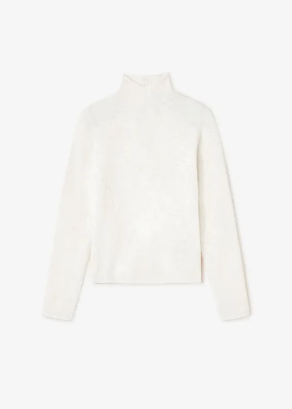 Sheer Flower Jacquard Mockneck sold by Denali